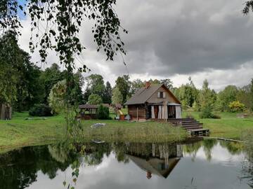 Фото Дома для отпуска Cabin with Sauna and pond, optional Hot Tube г. Ķeņini 1