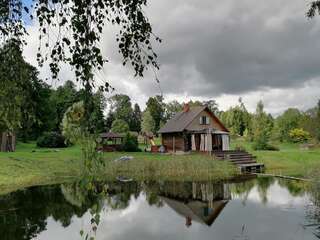 Фото Дома для отпуска Cabin with Sauna and pond, optional Hot Tube г. Ķeņini